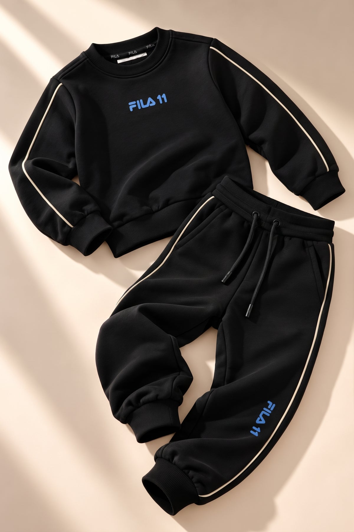 סט פוטר ניקי FILA לבנים בצבע שחור - חליפת פוטר קפוצון דגם 122019461
